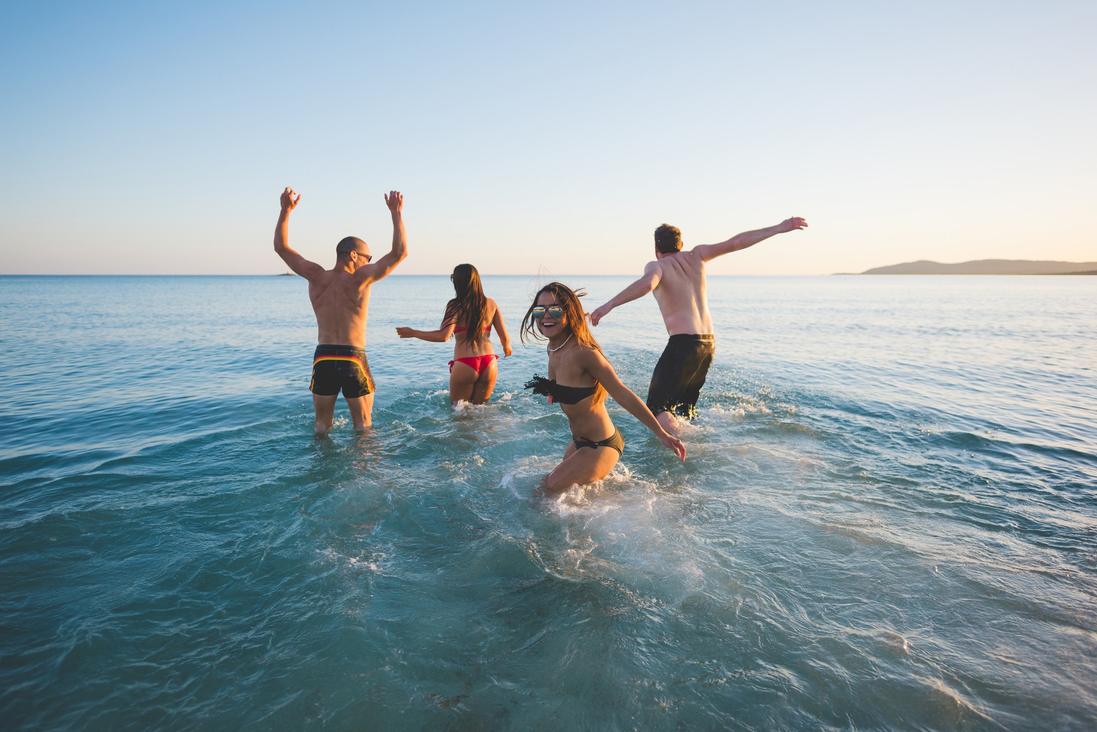 group of young multiethnic friends beach summer